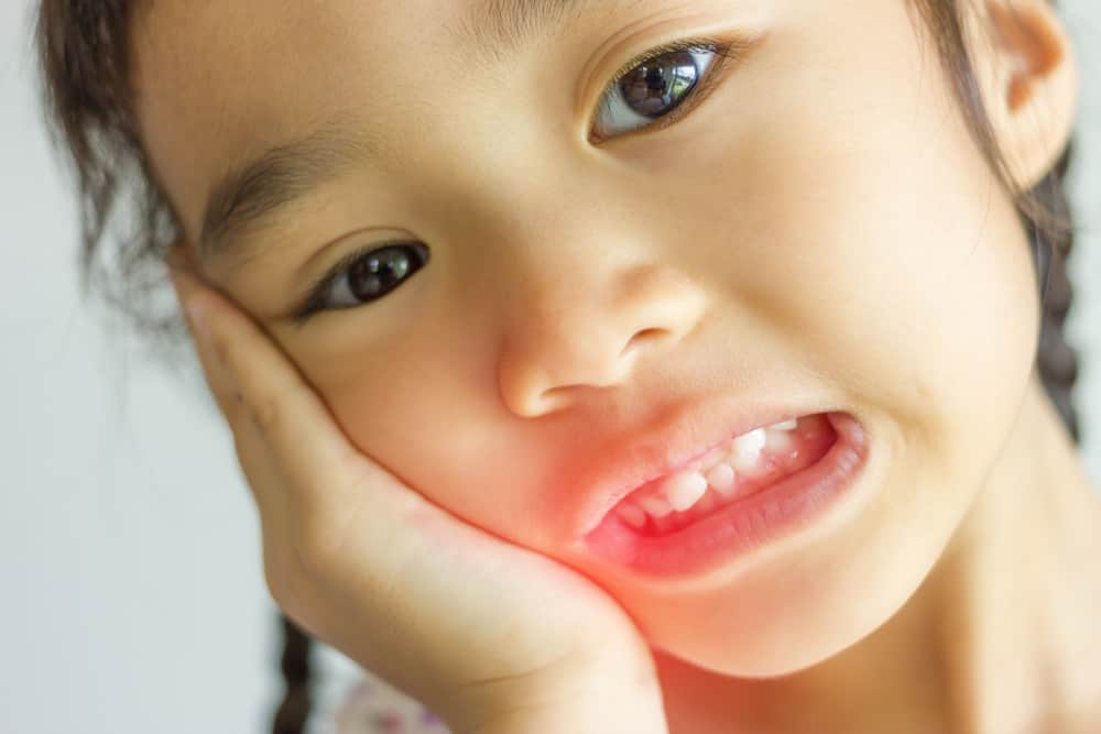 Child with a broken tooth